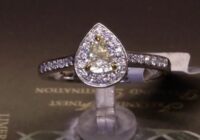 #64567 | NFY0.38ct | Yellow Pear Diamond with Round Brilliant Halo and Diamond Shoulders | Platinum