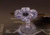 #83025 | T0.68ct | Emerald Cut Halo and Two Round Brilliant Halo Side Diamonds | Set in Platinum