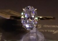 #88116 | T2.10ct | Oval Solitaire with Diamond Bezel under Head | Set in 18ct Yellow Gold